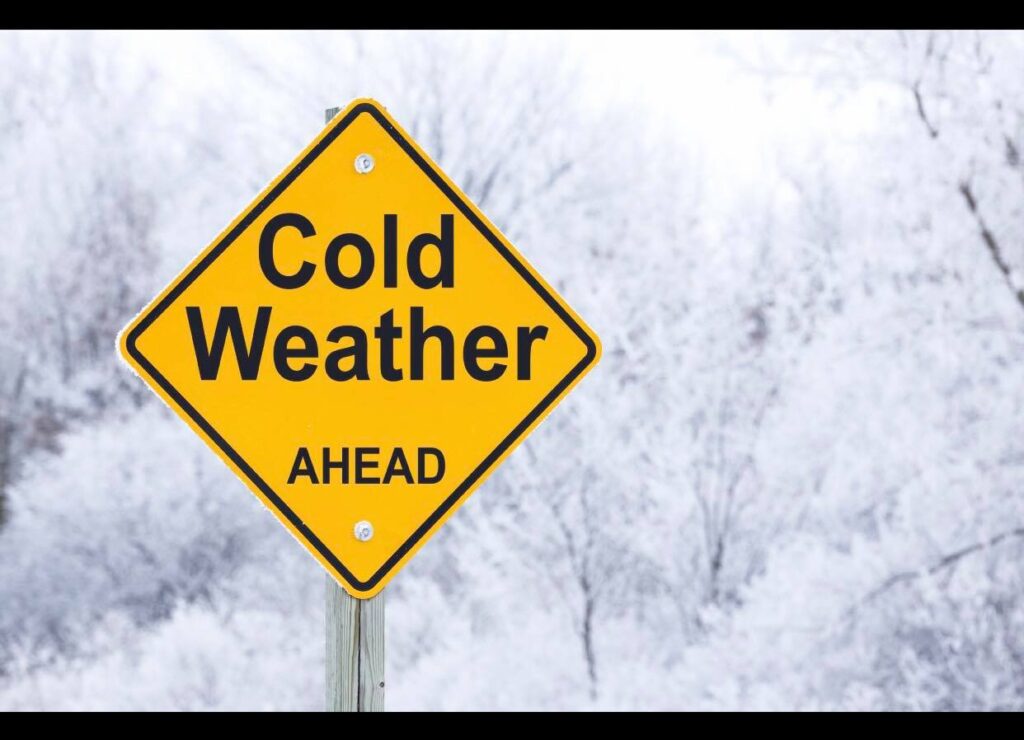 A warning sign that says "cold weather ahead"