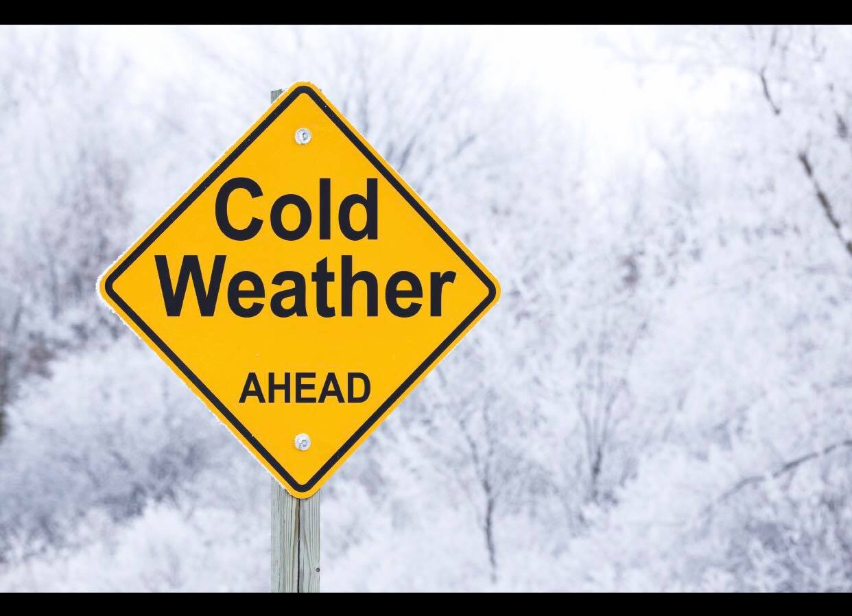 A warning sign that says "cold weather ahead"