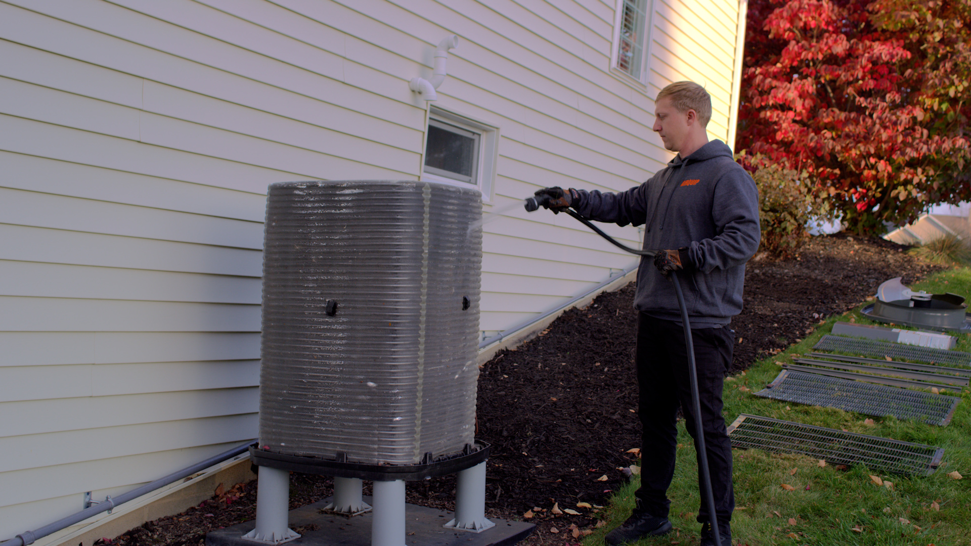 An Airquip specialist working outside on an HVAC unity
